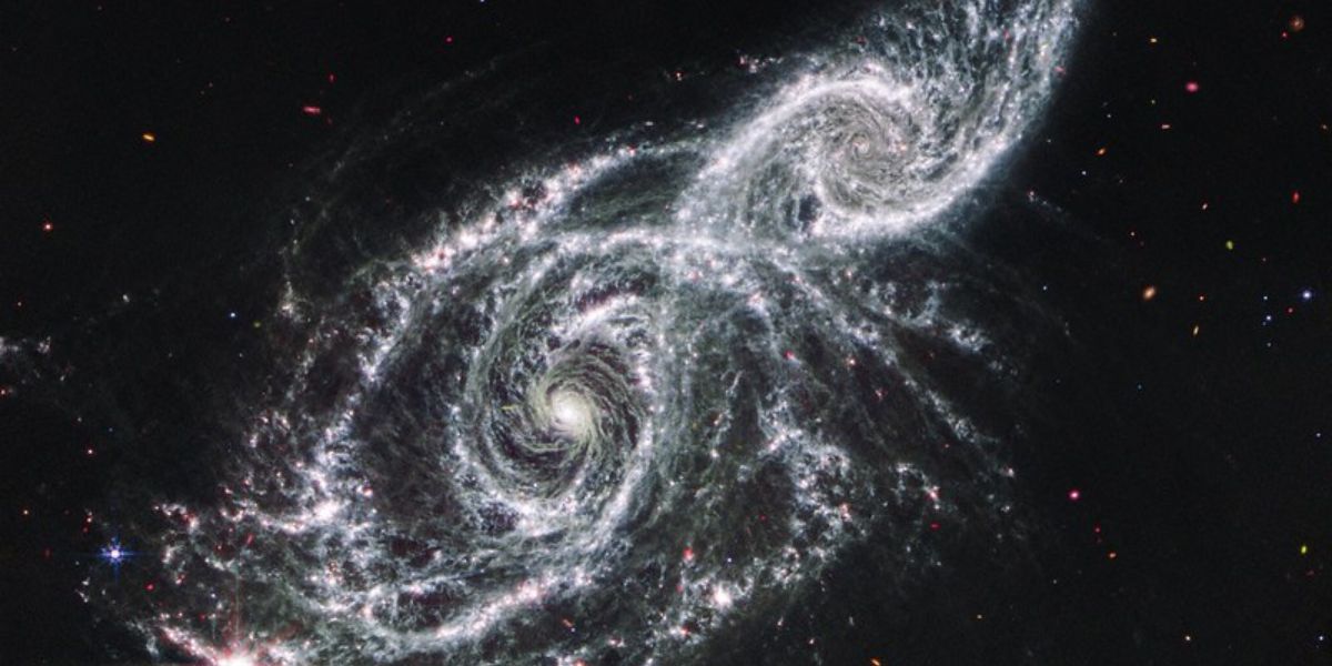 Cold Dust Between Two Galaxies, NGC 2207 And IC 2163